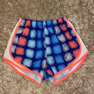 Nike shorts in blue and neon Orange polka dots
